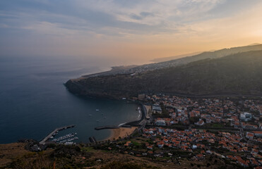 The town of Machico on Madeira Island at sunset. Panoramic top view from the mountain. October 2021