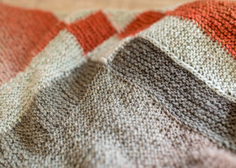 knitted wool scarf, traditional handicraft type, knitted background and texture, handmade, knitting pattern background