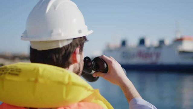  engineering watching with binoculars close up 