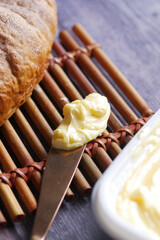 slice of a butter with bread on table 