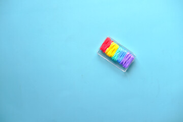 rainbow color Rubber bands on color background 