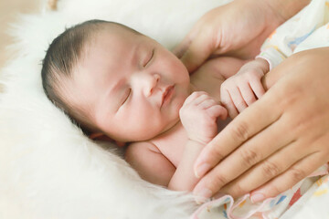 Mothers take care of the newborn with warmth.