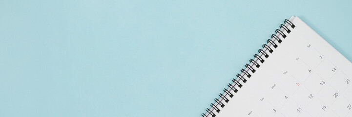 calendar on the table blue. empty copy space for text. concept for busy timeline organize...