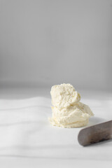 American buttercream on white parchment paper, buttercream with air pockets, textured buttercream