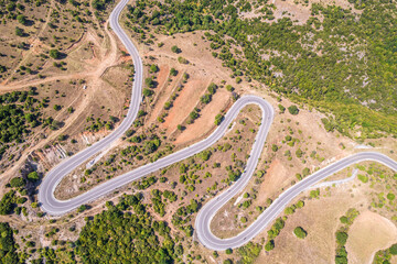 Meandering serpentine road in the mountain. Aerial view. Copter, drone view