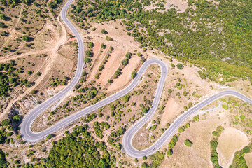Meandering serpentine road in the mountain. Aerial view. Copter, drone view