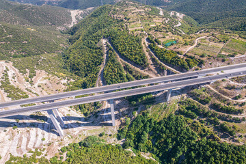 Aerial view on highway bridge in the mountain. Drone, copter view.