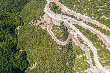 Meandering serpentine road in the mountain. Aerial view. Copter, drone view