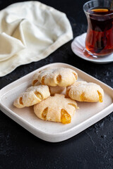 Orange Cookies. Cookies with delicious orange filling on a dark background. close up