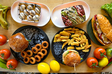 Table scene of assorted take out or delivery foods. Traditional Turkish cuisine. Various Turkish desert and cake. Top down view on a table.