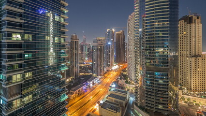 Fototapeta na wymiar View of the Dubai Marina and JBR area and the famous Ferris Wheel aerial night to day timelapse