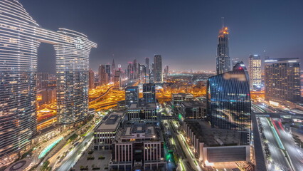 Fototapeta premium Futuristic Dubai Downtown and finansial district skyline aerial night to day timelapse.