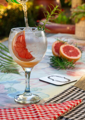 grapefruit cocktail in a tall glass