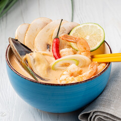 Soup with seafood, mushrooms and lime