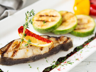 Halibut fish steak with vegetables beautifully served