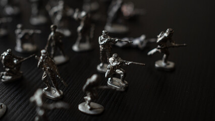 The concept of war and confrontation, political crises, toy tin soldiers attacking each other