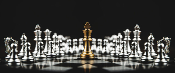 Close-up king chess standing on chessboard concepts of leader teamwork or volunteer or challenge of...