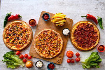 Traditional Turkish cuisine. Pizza, pita, pidesi, sucuk, hummus, kebab. Many dishes on the table. Serving dishes in restaurant. Background image. Top view, flat lay - Powered by Adobe