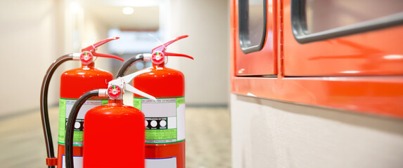 Fire extinguisher, Close-up red fire extinguishers tank in the building concepts of fire equipment for protection and prevent for emergency and safety rescue and alarm system training.