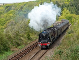 6233 Duchess of Sutherland steam train on the railway