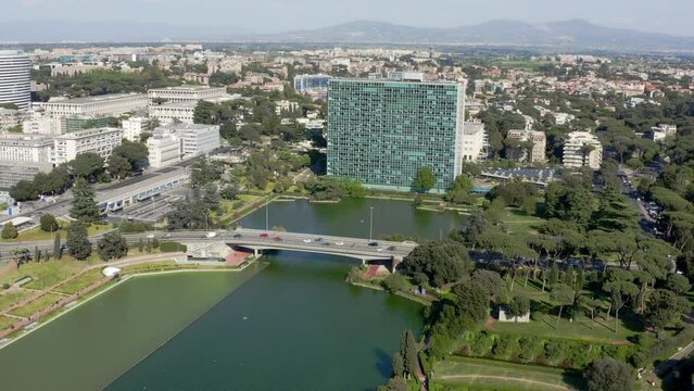 Aerial view of the modern EUR district in Rome, Italy,  built for the Universal Exposition that should have been held in the Capital in 1942. There is a small artificial lake and the neighborhood park