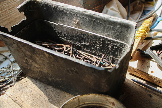 Old Rusty Nails In A Broken Bread Mold