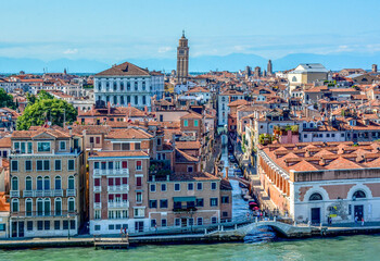 Naklejka premium View from cruise ship departing Venice along the Giudecca Canal passing colourful waterside building in the Canal Rio de la Salute, from Fondamenta Zattere Al Saloni, Venice, Italy