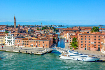 Fototapeta na wymiar Panoramic view of Waterfront Riva Sant Biasio Brigde with Tourists Motor yacht Trident moored outside the Museo Storico Navale (naval history museum) in Venice, Italy