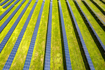 aerial view of solar panels on a sunny day. power farm producing clean energy