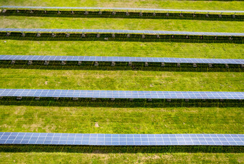 aerial view of solar panels on a sunny day. power farm producing clean energy