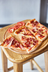 pizza with salami on a table 