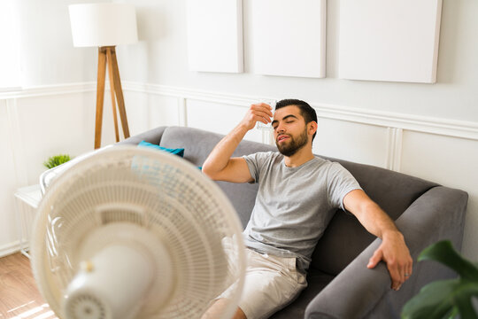 Latin Man Feeling Hot And Sweating