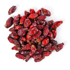 Heap of red dry rose hips isolated on a white background. Top view.