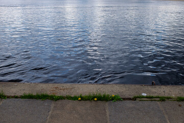 ank of the Dnieper River. Waves hit the rocky shore