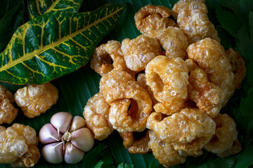 Pork skin,Chicharron - Deep-fried pork, crispy pork skin, Mexican dessert, traditional Thai food.