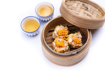 Freshly steamed siew mai or shaomai is poular Cantonese Chinese dim sum delicacy