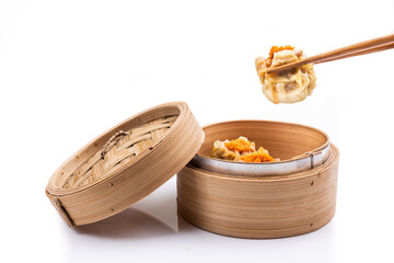 Freshly steamed siew mai or shaomai is poular Cantonese Chinese dim sum delicacy