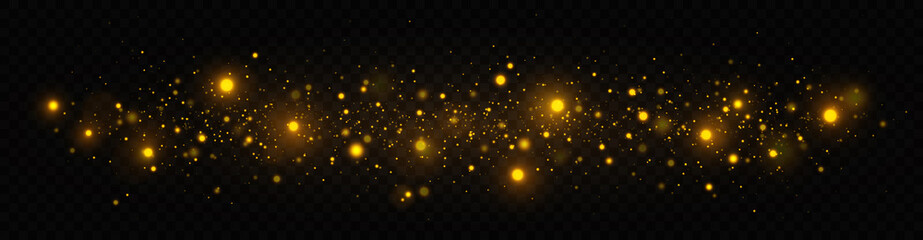 Golden shimmering background with light effect. The dust sparks and golden stars shine with special light on a transparent background. Christmas concept.
