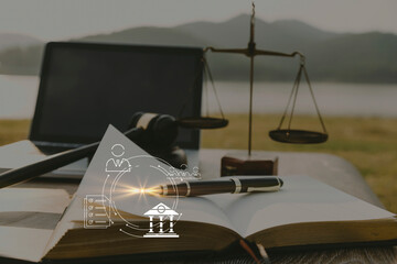 Judge gavel and legal book on wooden table, justice and law concept