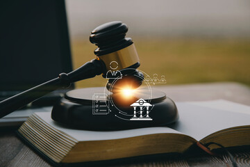 Judge gavel and legal book on wooden table, justice and law concept
