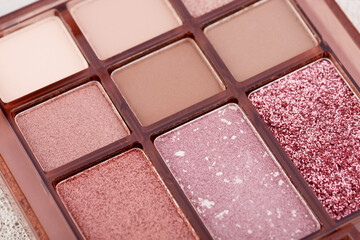 Mua and girly concept. Eyeshadow palette on concrete background  close up. Eye shadows cosmetics product as luxury beauty brand promotion. Contouring palette. Makeup palette.