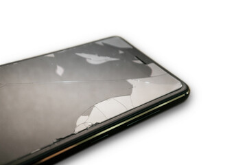 Broken glass of smartphone with blurred background on isolated white.