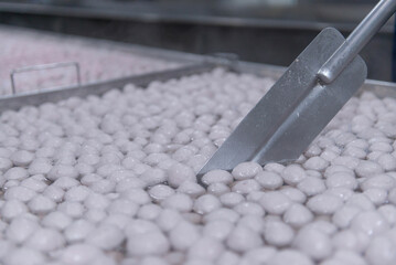 boiling pork meat balls in hot pot
