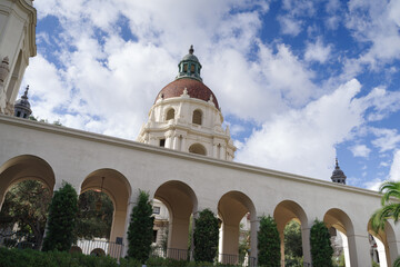Fototapeta na wymiar East arcade and main tower of the Pasadena City Hall. The Pasadena City Hall is a landmark in Pasadena, California, USA. This iconic building is listed in the National Register of Historic Places.