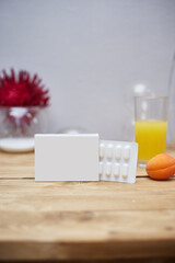 vitamin packaging on a wooden table