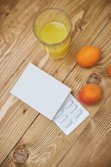 vitamin packaging on a wooden table