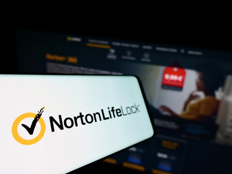 Stuttgart, Germany - 03-06-2022: Smartphone with logo of American software company NortonLifeLock Inc. on screen in front of business website. Focus on left of phone display.