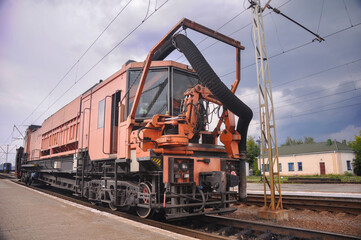 Locomotive for railway work stands on a stake