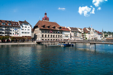 Fototapeta na wymiar Lucerne, Switzerland - old wooden bridge and buildings on the lake embankment