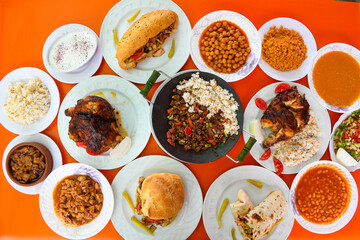 Table scene of assorted take out or delivery foods. Traditional Turkish cuisine. Various Turkish meal and appetizers. Top down view on a table.